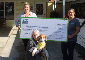 Northshore Humane Society accepting a Shelter Surprise check