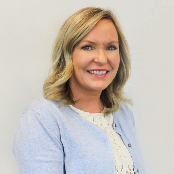 Hospital Director, Angie Heighton, smiling happily