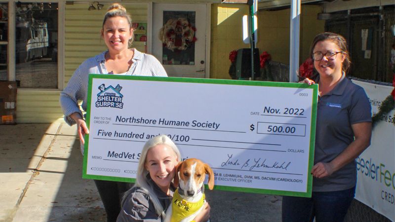 MedVet presents the Shelter Surprise 3rd place winner, Northshore Humane Society with a giant check for $500