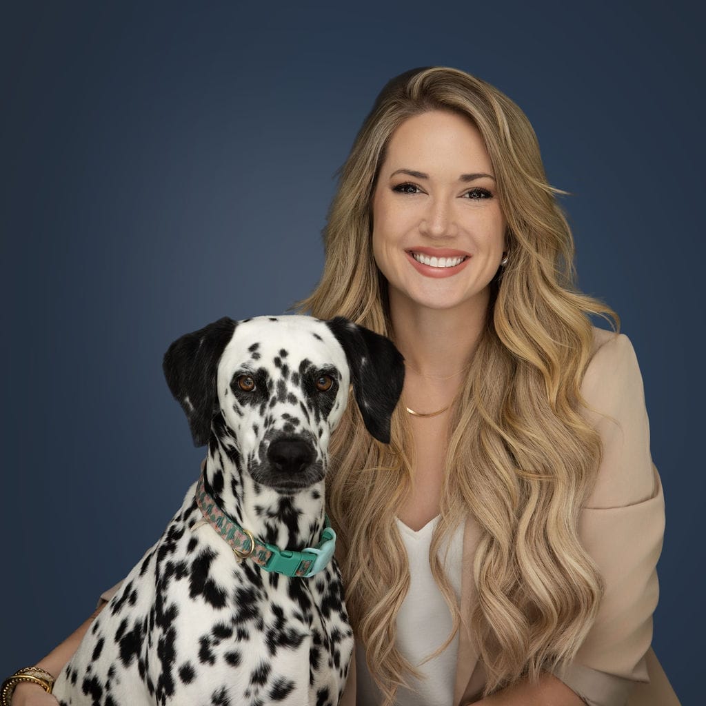 Laura Reed, DVM headshot with pet